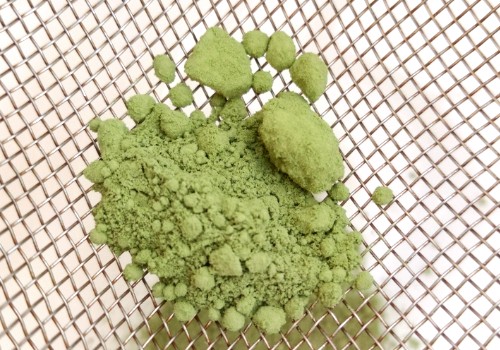 clumps of matcha on a strainer