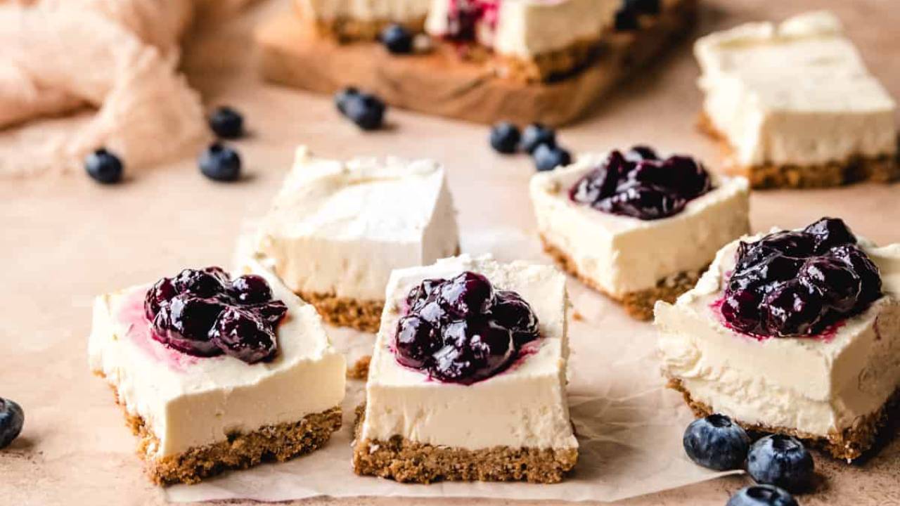 goat cheese cheesecake bars topped with fresh blueberries
