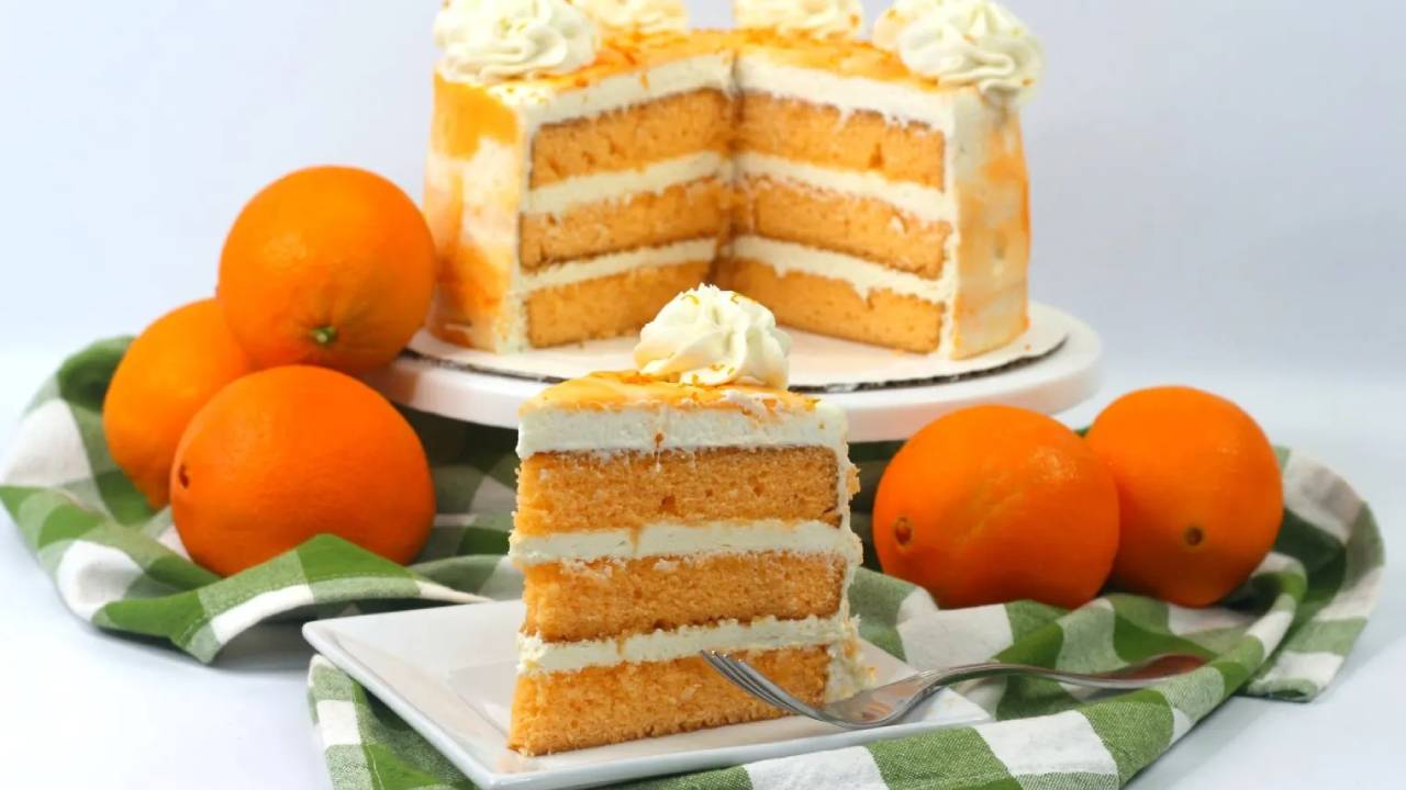 orange cake with layers sliced and on a plate