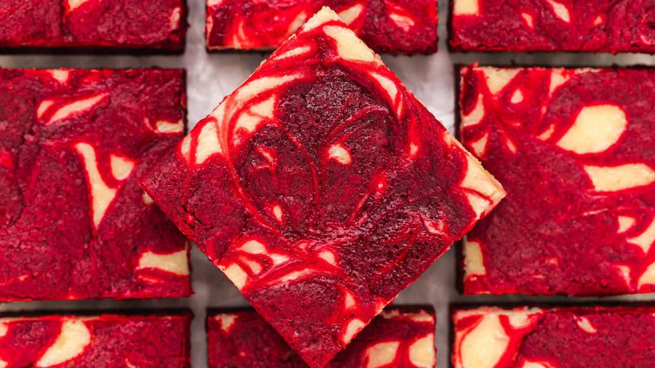 red velvet brownies with cream cheese cut into squares