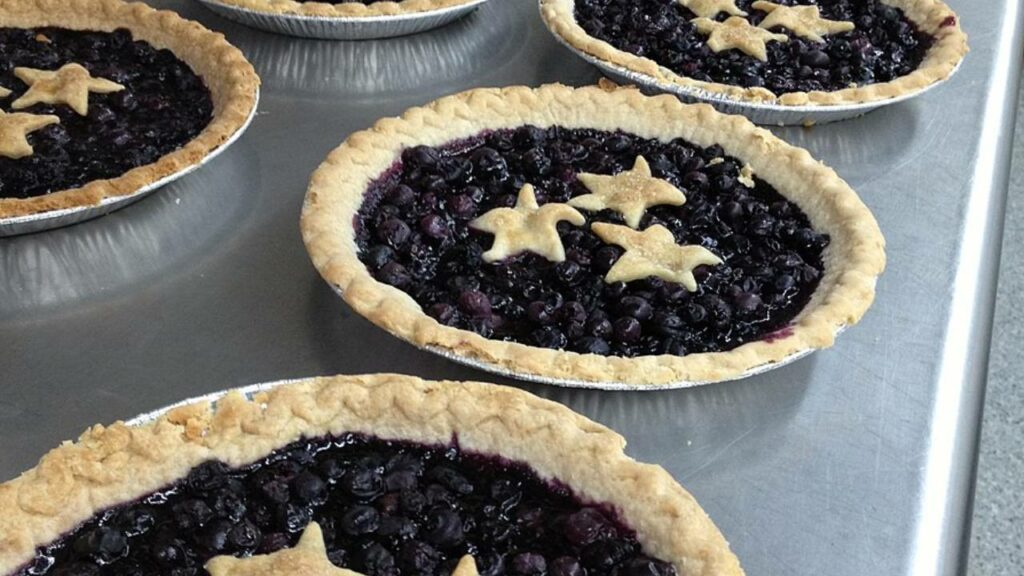 blueberry pies in line for a contest