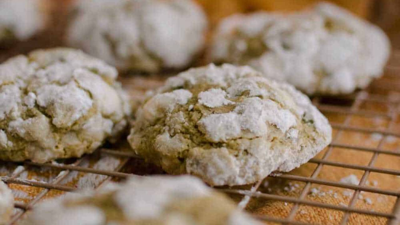 matcha tea crinkle cookies on a baking rack