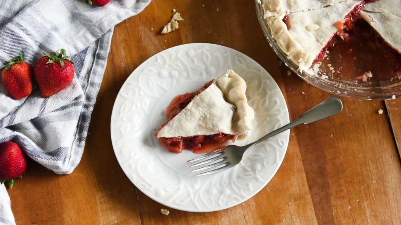 strawberry rhubarb pie slice on a plate