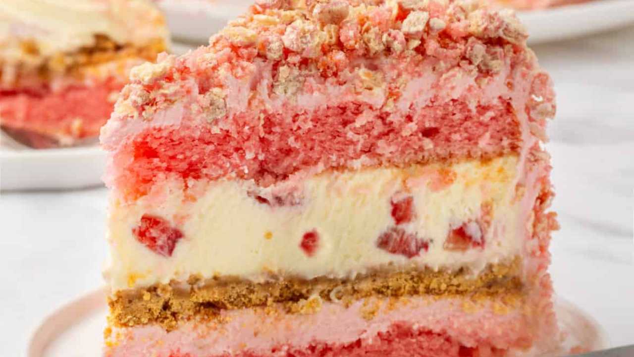 strawberry shortcake cheesecake slice on a plate