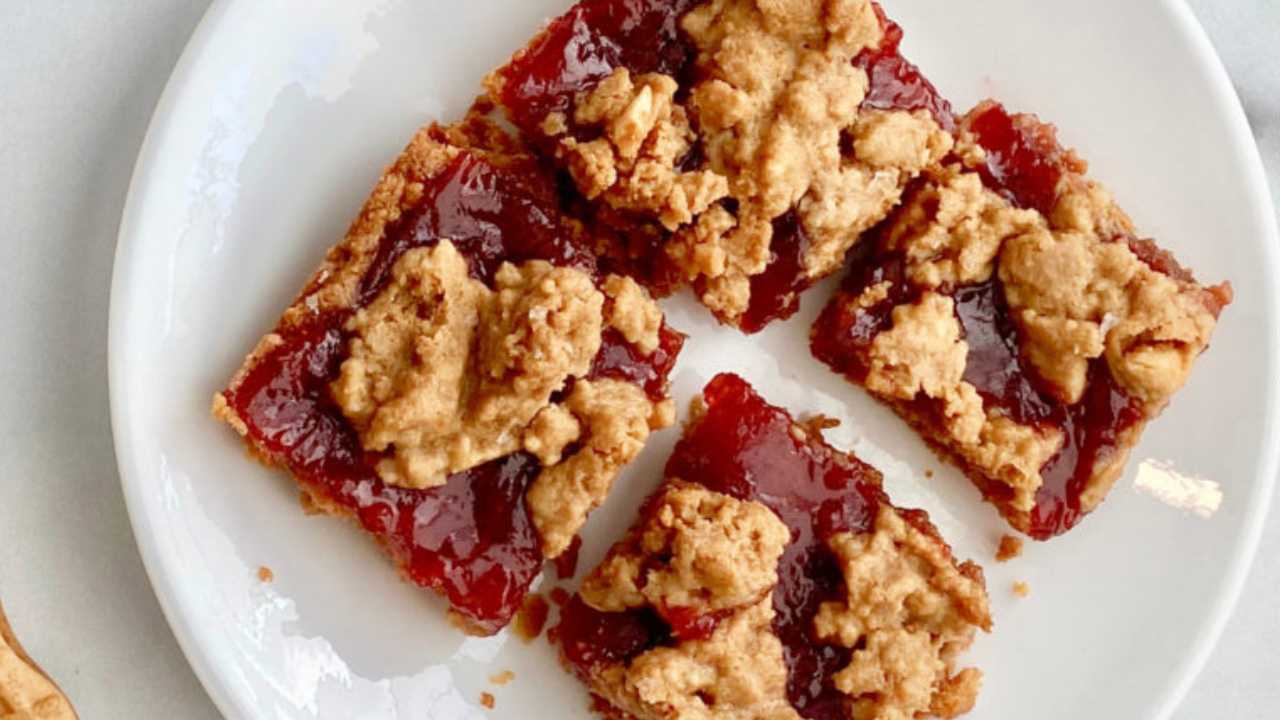 nutter butter and jelly bars in quarters on a plate