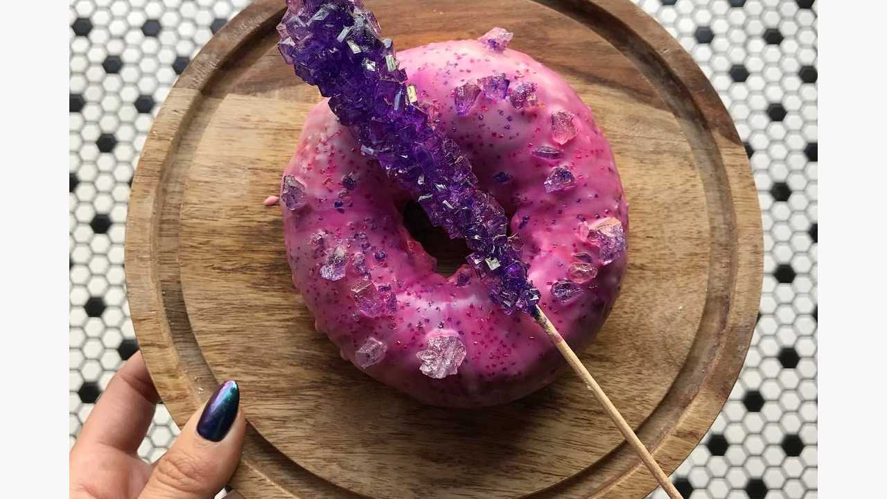 rock candy donut on wooden plate