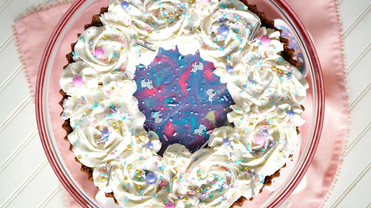 white chocolate cheesecake with unicorn design